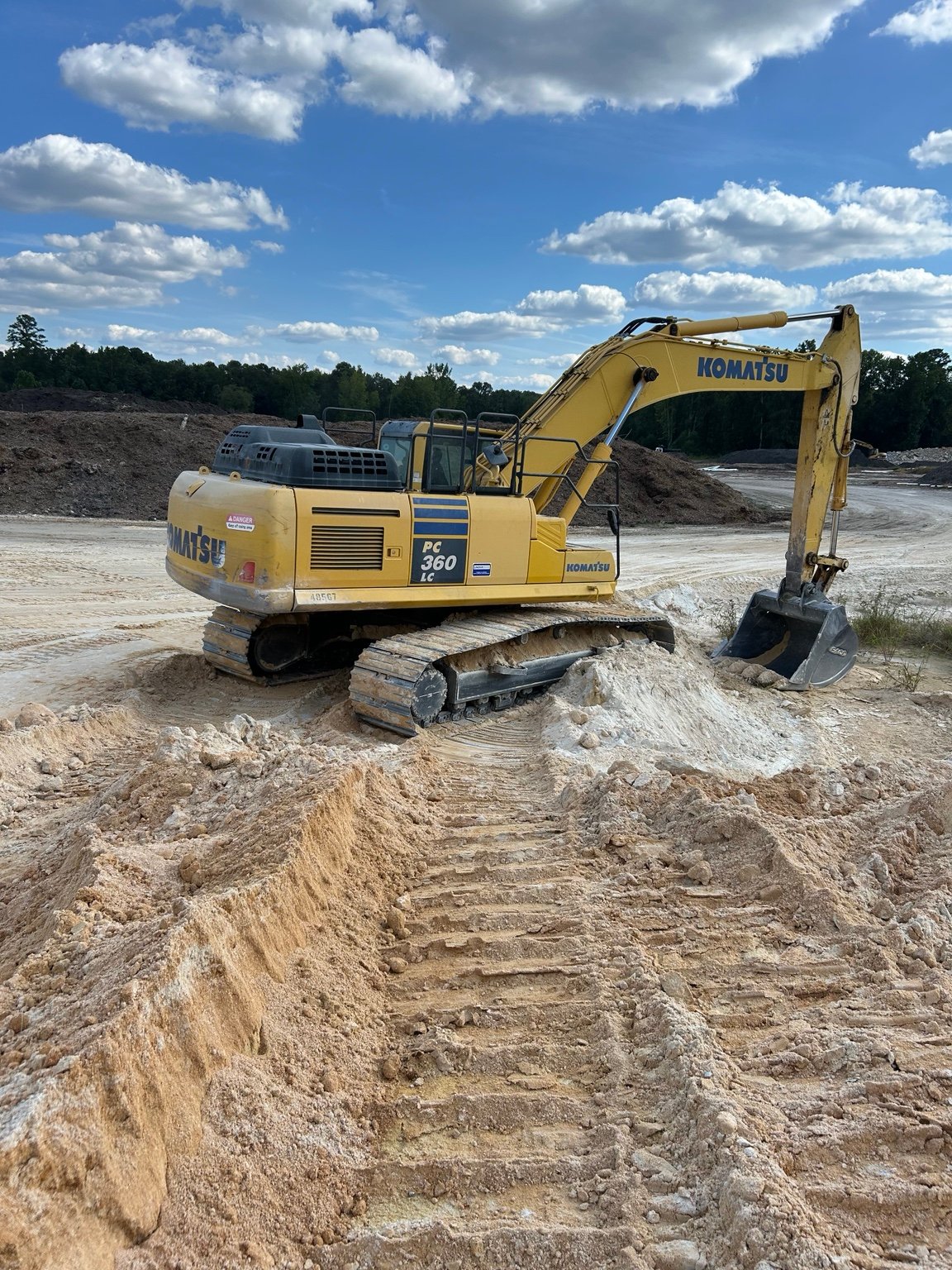 Komatsu excavator working in the Sand Clay source area at Pit 421