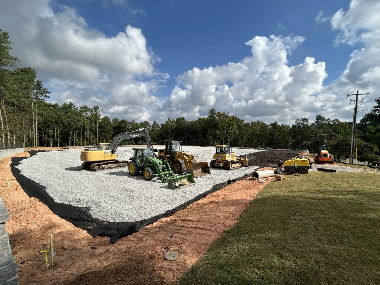 Contractor-led site preparation and aggregate base work